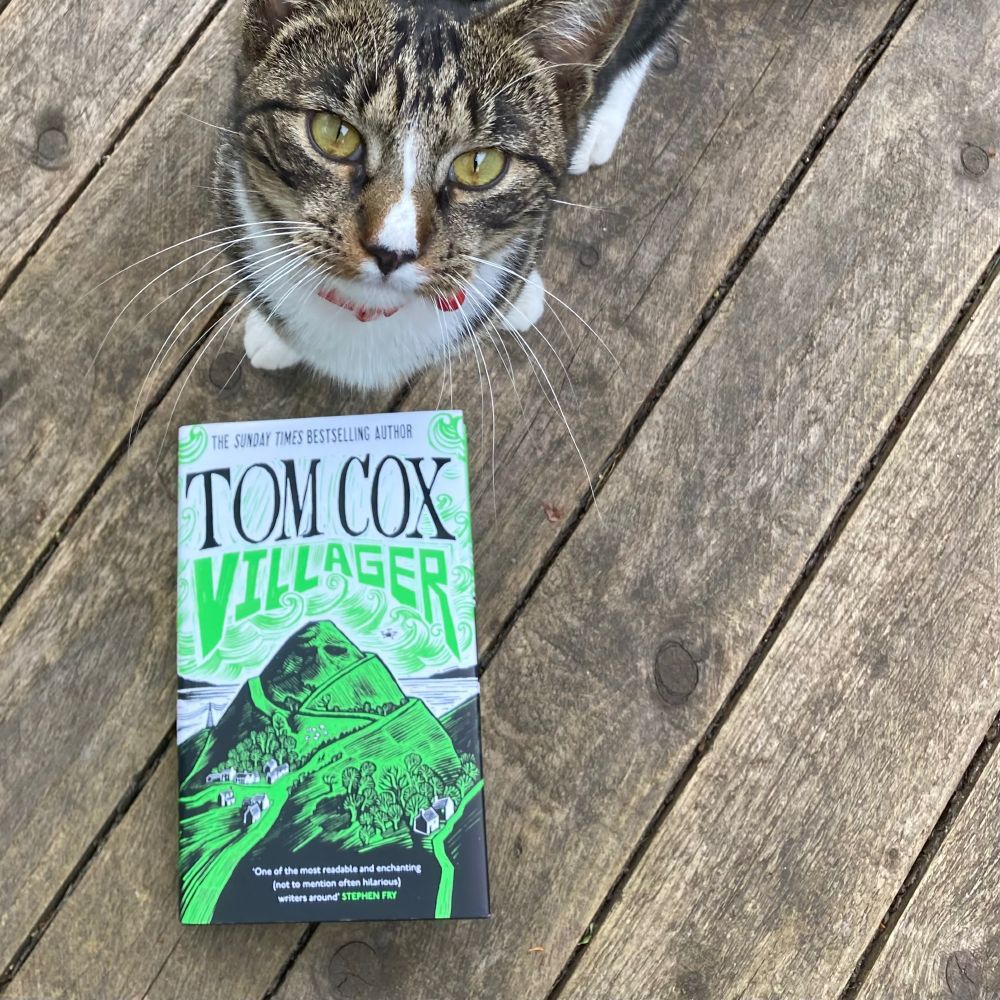 Our cat Professor Charles Cardigan with the hardback of Villager, not long after it was published. 