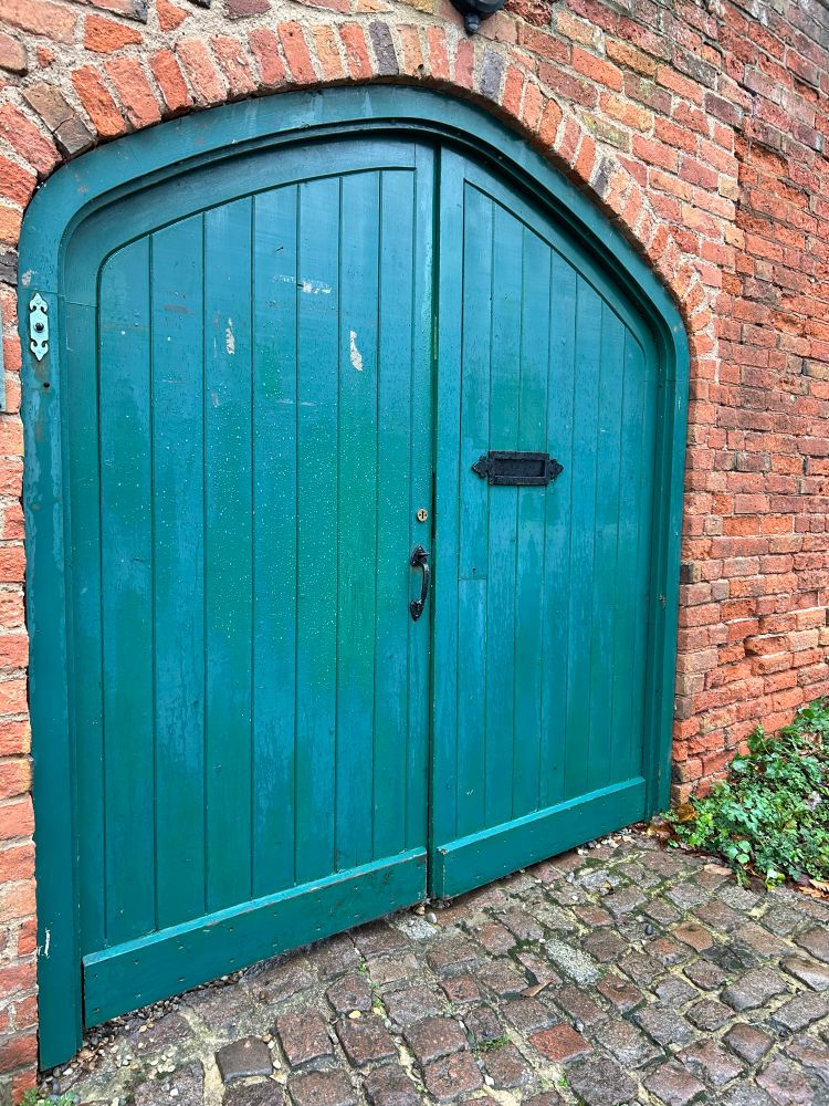 A fabulous old green door in an even older wall
