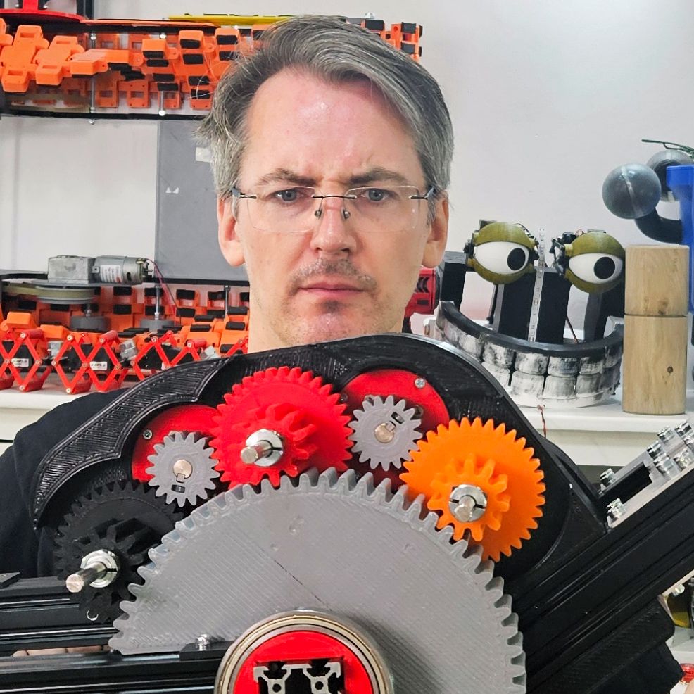 A man looks at a weird gearbox