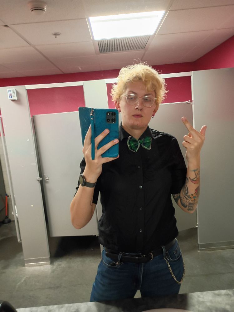 Rose in a black top and green bowtie 