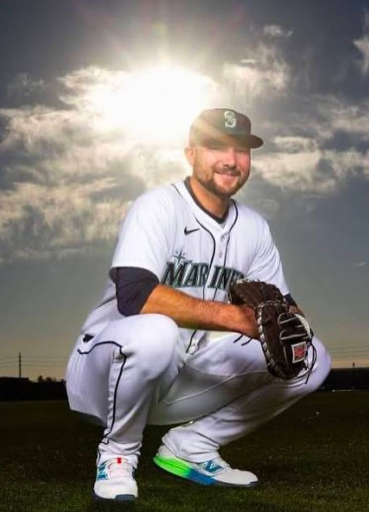 Call Raleigh in his home white uniform with his catcher's mitt, squatting, smiling, backlit by the sun illuminating him like the angel he is