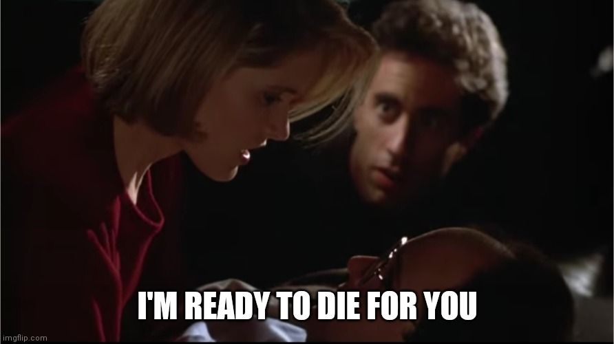 Woman lying over George Costanza inside a dark limo saying, 