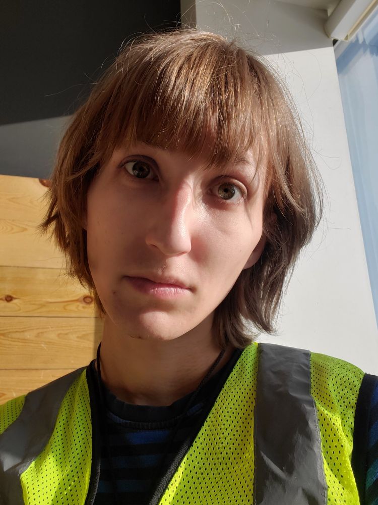 A selfie of me wearing a hi-vis vest and pouting