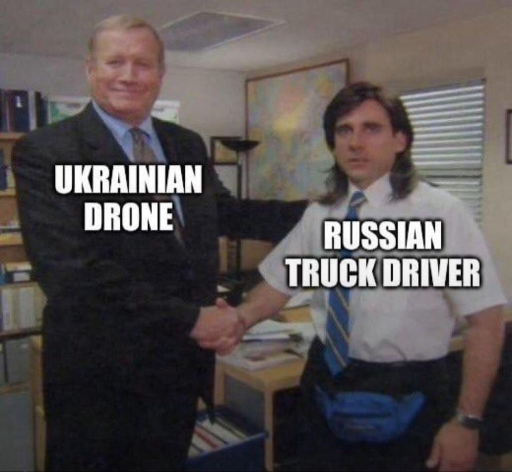 A screenshot from the office with a Ukrainian drone shaking hands with a surprised Russian truck driver.