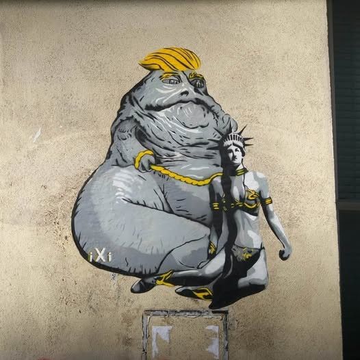 Graffiti of Habba the hutt with Trump's hair and slave Leia has the statue of Liberty's head.