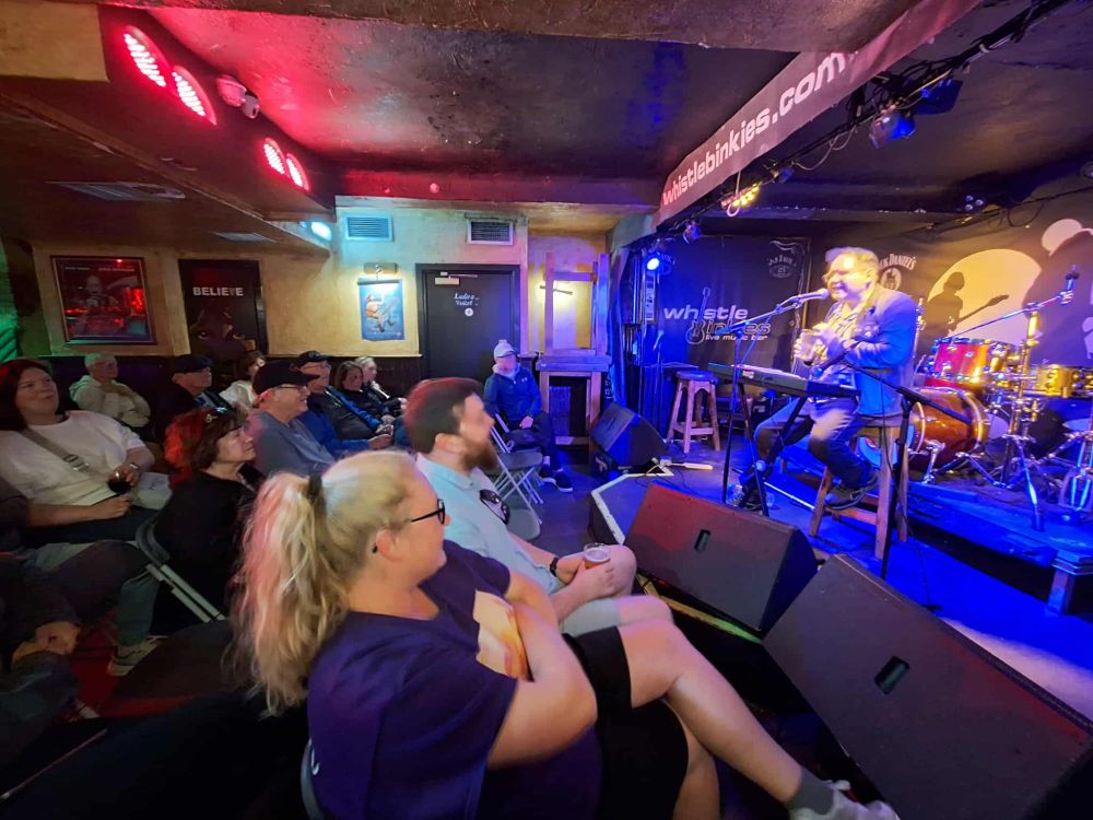 Friz Frizzle performing on stage.