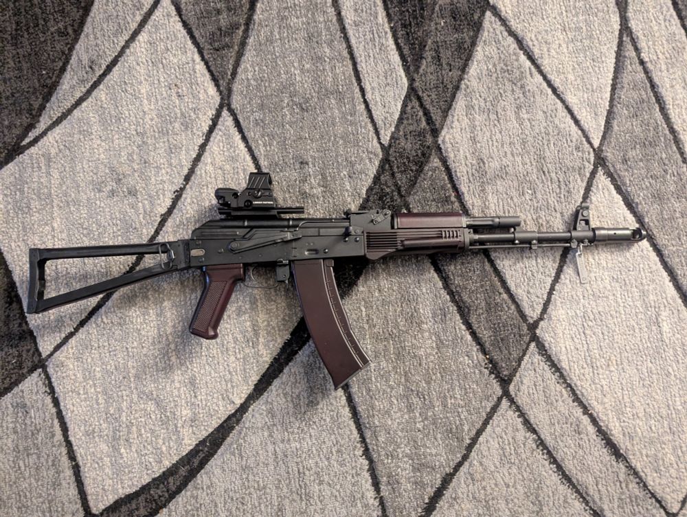 E&L AKS-74M with imitation plum furniture, Lancer Tactical red dot, and Ukrainian recycled metal keychain