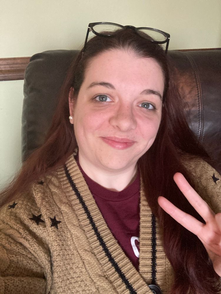 A selfie of Mari giving a millennial peace sign in her new Fearless TV cardigan.