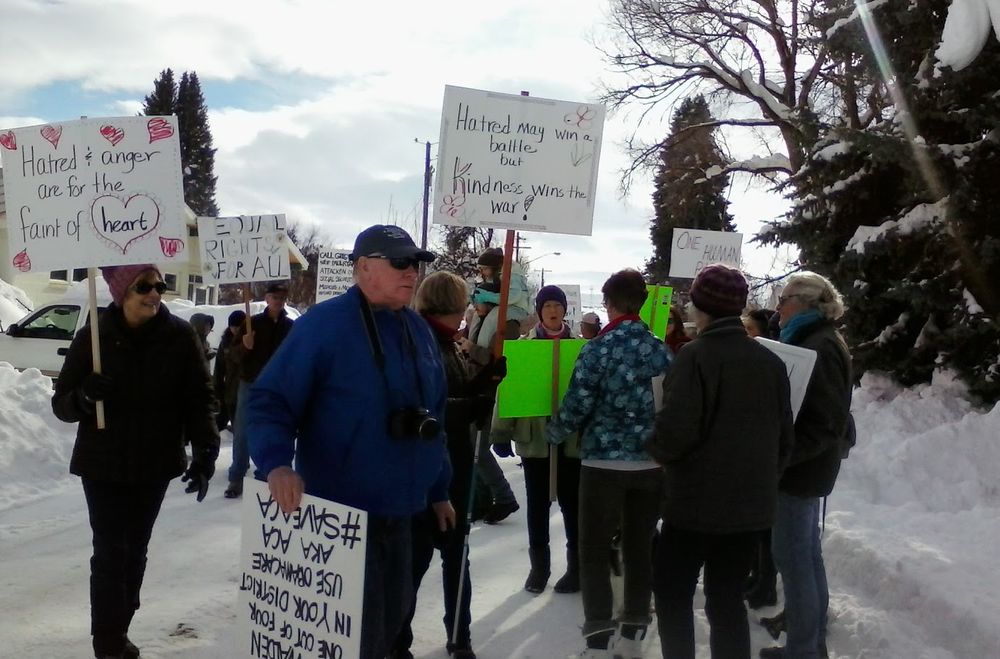 Picture from the 2021 Women's March Sister March in Halfway, Oregon.  We had over 3 feet/1 meter of snow fall (on top of already over a foot of snow) the night before.  The local men came out at sunrise and started plowing and shoveling the main road of this tiny town of 190 people so "the girls can have their little thing" ... then they all joined us in our sister march!  Over 60 people marched that day, and more would have come if they could have dug themselves out!