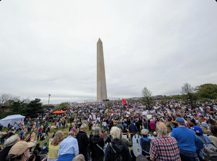 Protest in Washington, DC on April 5, 2025 showing some of the tens of thousands of protesters with the Washington Monument standing proud in the distance.