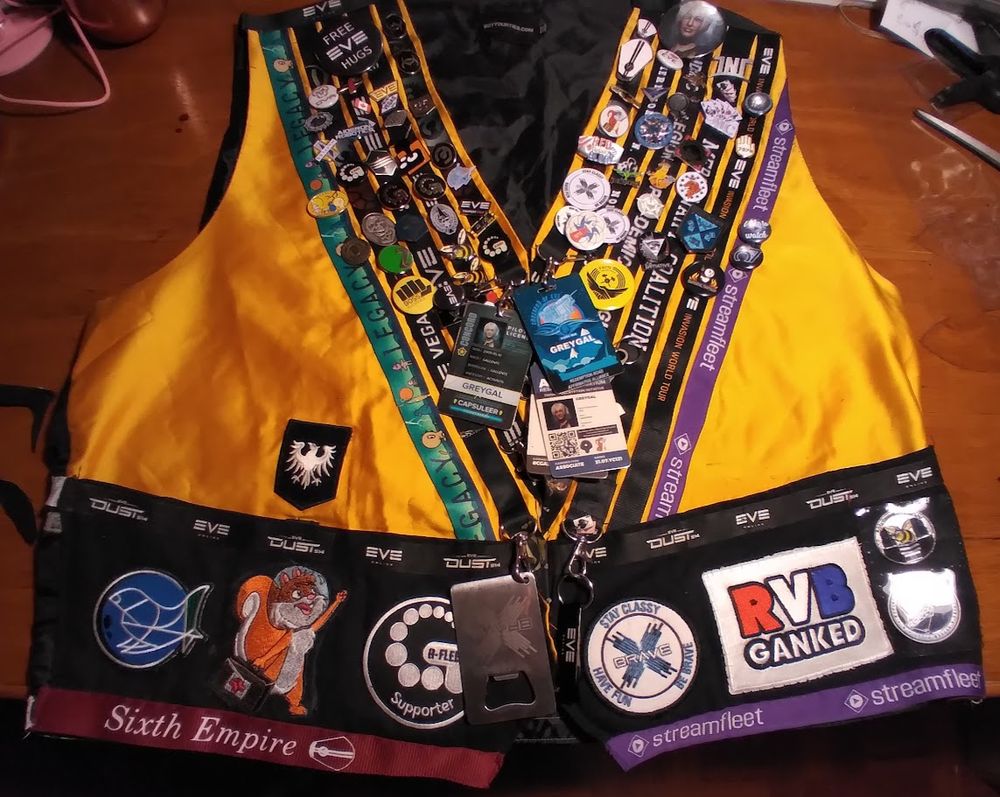 My EVE Online swag vest.  It's a bright yellow vest with all my EVE event lanyards sewn on it in a large V, covered with lapel pins and patches from numerous corporations and alliances.