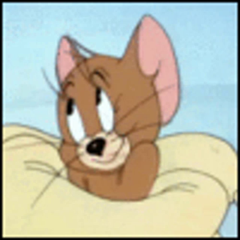 jerry from tom and jerry is sleeping on a pillow