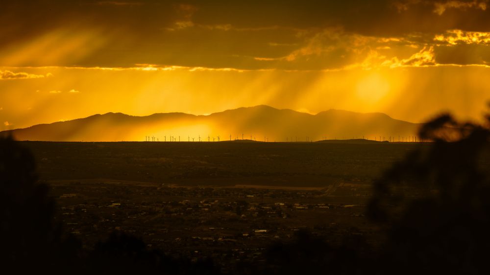 Golden, crepuscular light illuminating Mt. Taylor from a location near Albuquerque, New Mexico 