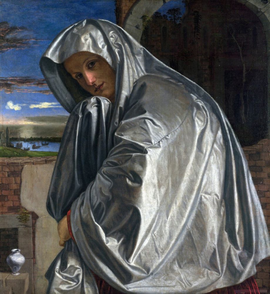 "Mary Magdalene," a c.1535-1540 oil on canvas painting by Giovanni Girolamo Savoldo.  A women, head inclined, looks at the viewer. Sky, sea with ships, and a brick columnar structure behind her. She is draped in fabric (silk?) on which the play of light is, to me, almost photorealistic. 
