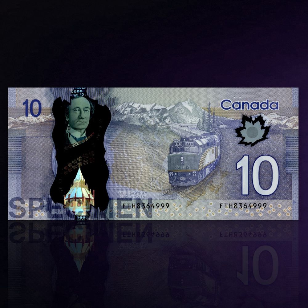 Billet de banque montrant un train de passagers de face serpentant dans un paysage montagneux.