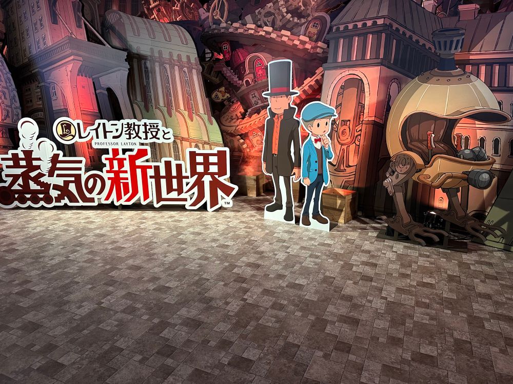 A steampunk style set promoting a new Professor Layton game featuring life-size standees of the title and the main characters. 