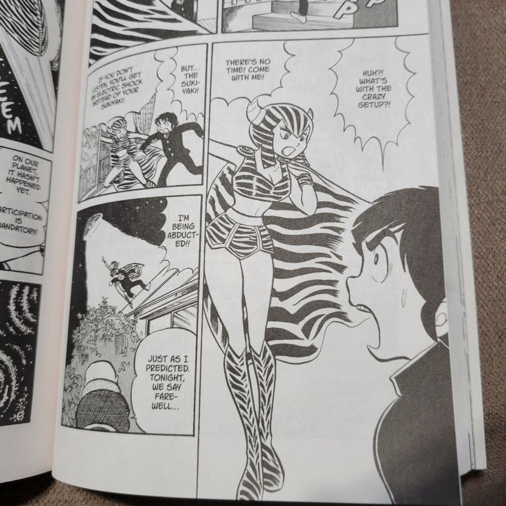 Lum wearing her battle outfit forcing Ataru to go to her home planet.