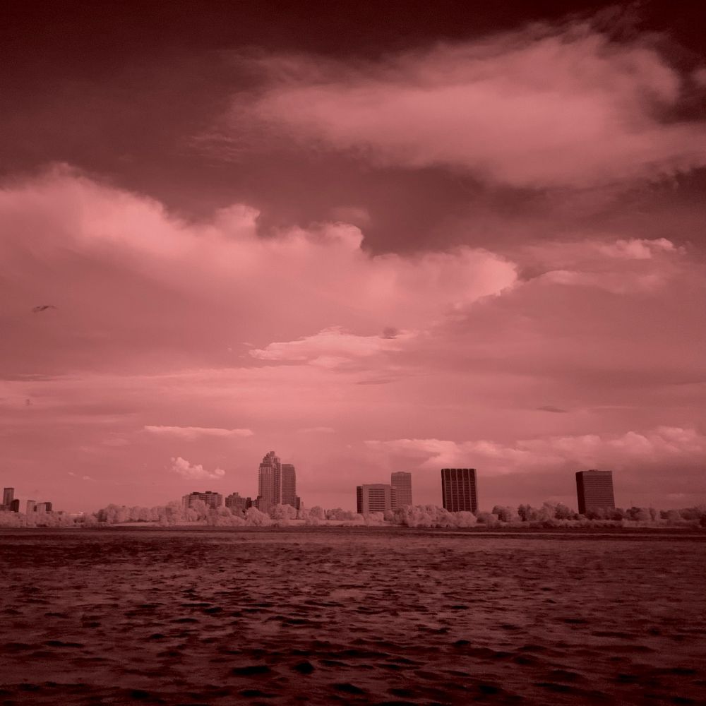 An infrared view across the Ottawa River to the Tunney's Pasture complex.
