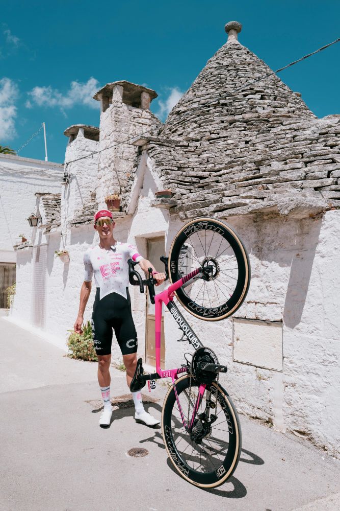 Mikkel Honore standing outside of a Trulli house