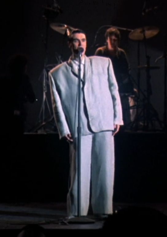 Man wearing huge suit. (Talking Heads.)