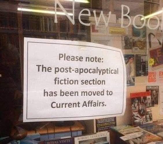Sign on window.

Text: Please note: the post-apocalyptical fiction section has been moved to Current Affairs
