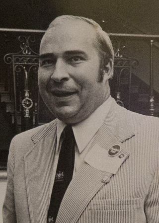 Black and white photo of Budd Dwyer in a corduroy shit and necktie