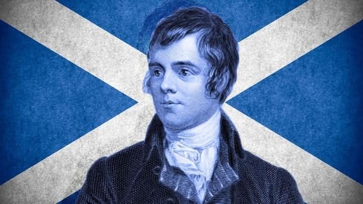 A picture of Rabbie Burns in front of the Saltire flag