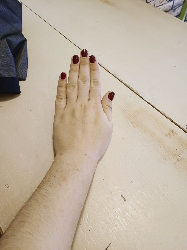 a hand with posing straight to show the nails