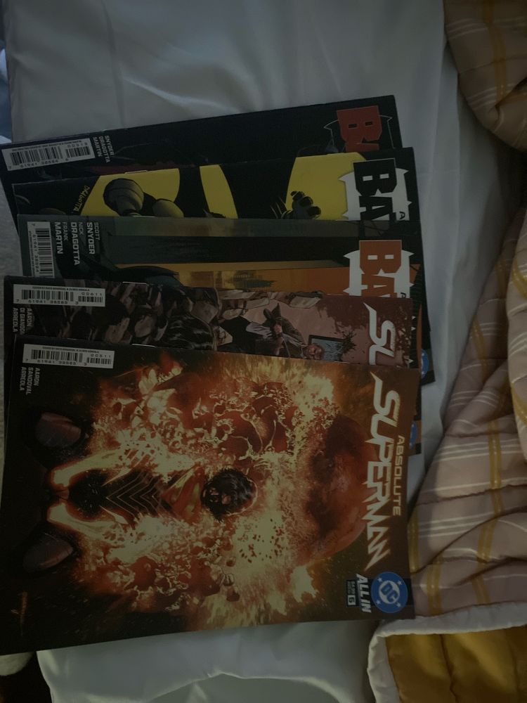 Comic book spread. Absolute Superman #5 & 6 and Absolute Batman #1 - #3