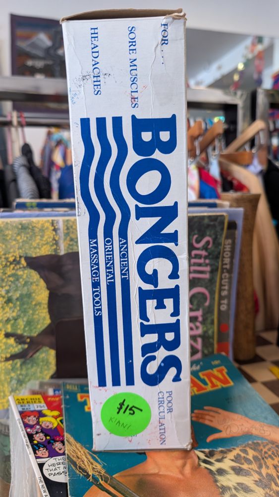 A vertical, thin box which reads "Bongers, ancient oriental message tools for sore muscles, headaches, poor circulation" marked for sale at $15