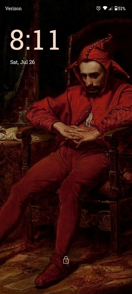 Screenshot of lockscreen- 1862 painting Stańczyk by Jan Matejko, an oil painting of a jester wearing his red suit and sitting isolated and away from a ball, hopeless as his eyes are sunken in shadow. 