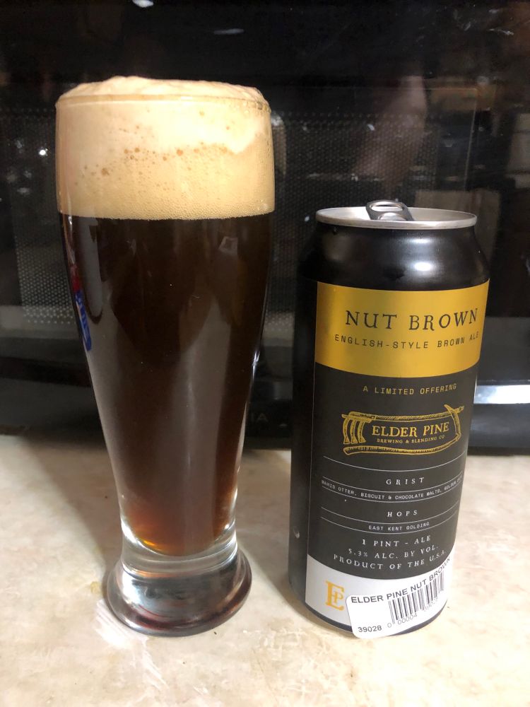 Dark English ale in a pint glass