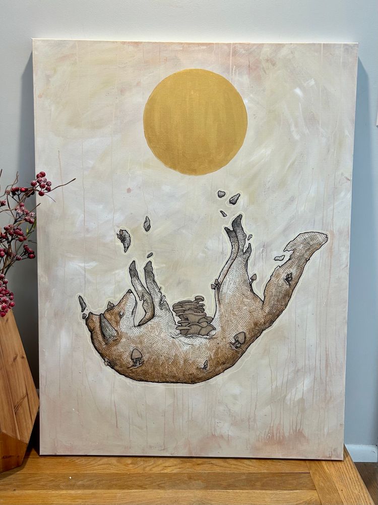 A fox painting made from paper. A golden sun is above it.