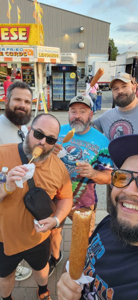Five men at a fair 