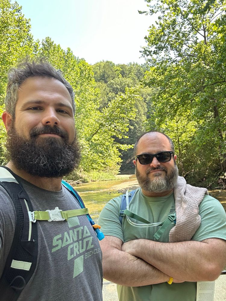 Two bearded men taking a photo 