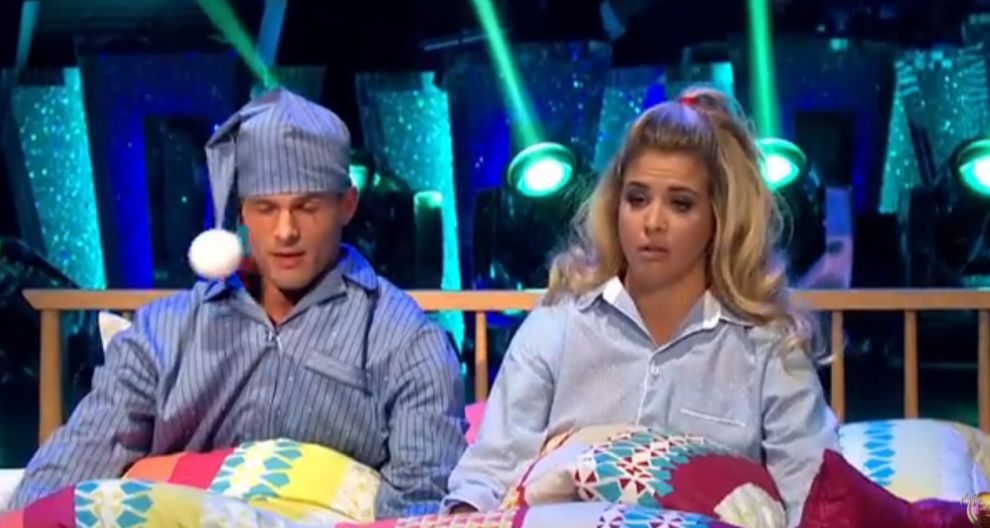 Aljaz and Gemma in bed pretending to have just woken up and looking severely hungover
