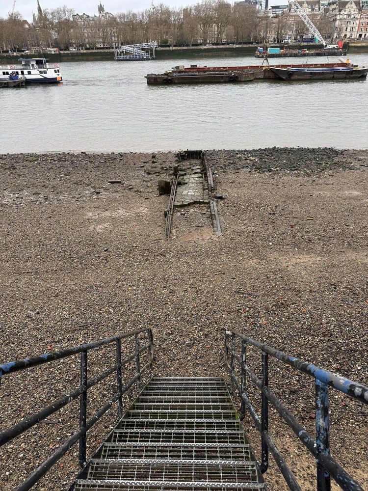 The Thames at low tide from the Southbank exposing an old jetty 