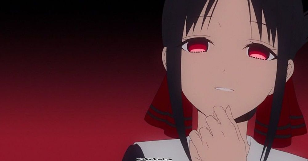 Kaguya Shinomiya puts her hand to her chin as she mockingly says “How cute” in the Kaguya-Sama: Love is War anime.