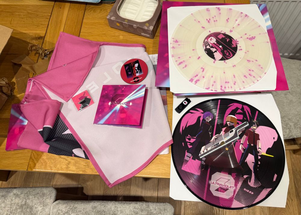 Goodies from the savlonic kickstarter - vinyl picture disc, shawl thing, cd picture book and some pins and stuff. Also USB!