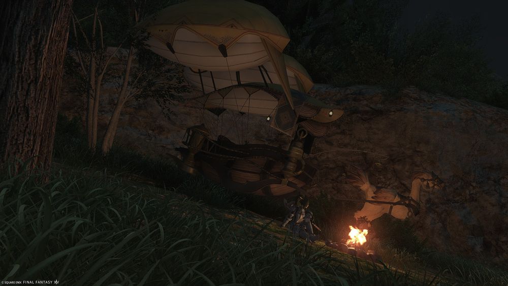 Sa sitting next to a campfire with a chocobo carriage behind her