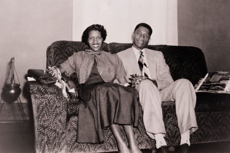 Myrlie and Medgar Evers sitting together on a couch
