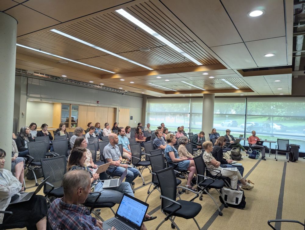 MSP LTER researchers watching a presentation in a large room.