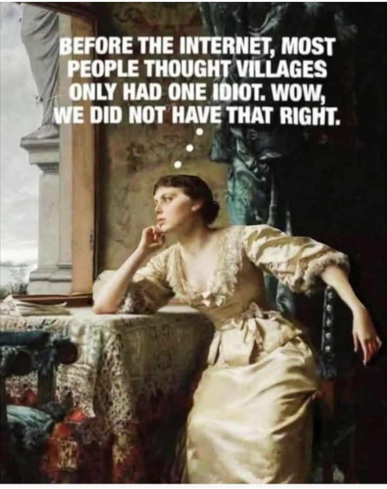 Woman in early 1800s clothing looking wistfully out a window