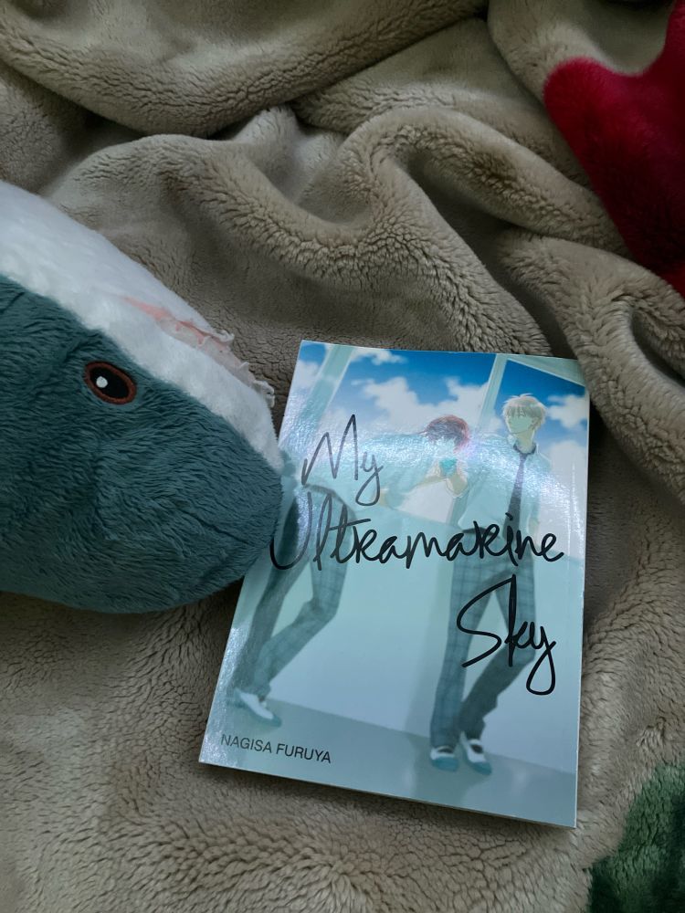 An image of the manga “My Ultramarine Sky” paired with the popular IKEA stuffed product Blåhaj