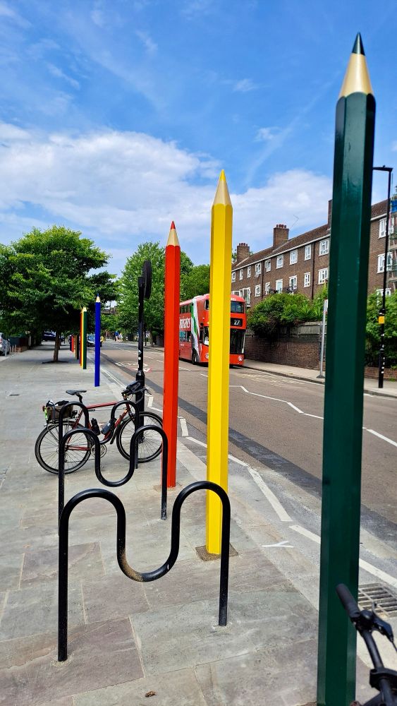 Supersized multi colour pencil bollards line the street and make it perfect,