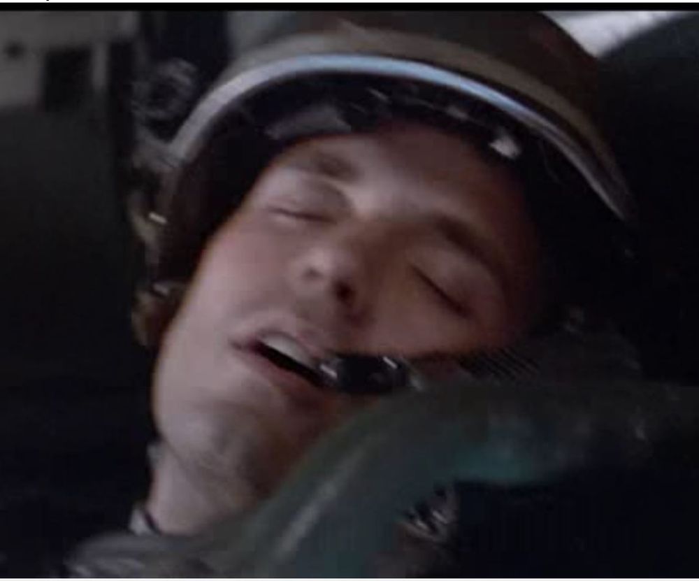 A Space Marine soldier from Alies (1986) asleep in his dropship harness.
Other members of the crew were seen freaking out because of the turbulence. 
But not Hicks, plaid by lean caucasion mean 
Micheal Biehn. 