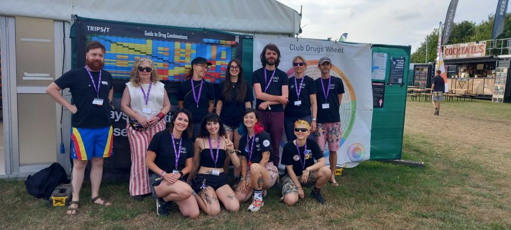 Image of some happy Loop volunteers in front of our tent