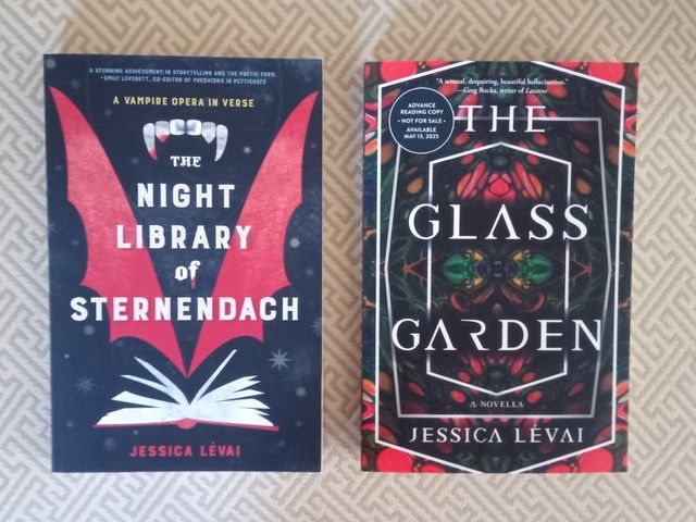 My two novellas: THE NIGHT LIBRARY OF STERNENDACH: A VAMPIRE OPERA IN VERSE, and THE GLASS GARDEN. The first has batwings, fangs, and a book on the cover. The other has white letters on a kaleidoscope image.