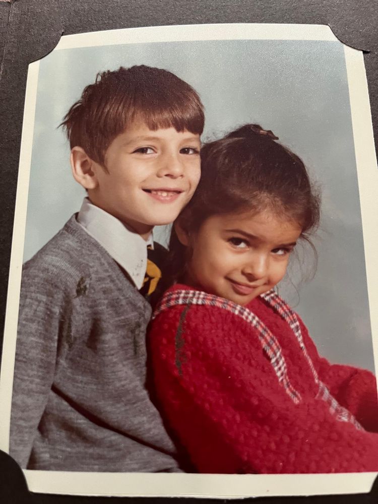 Childhood photograph of a brother and sister.