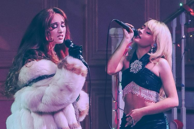 sabrina carpenter and chappell roan in the trailer for a nonsense christmas 
